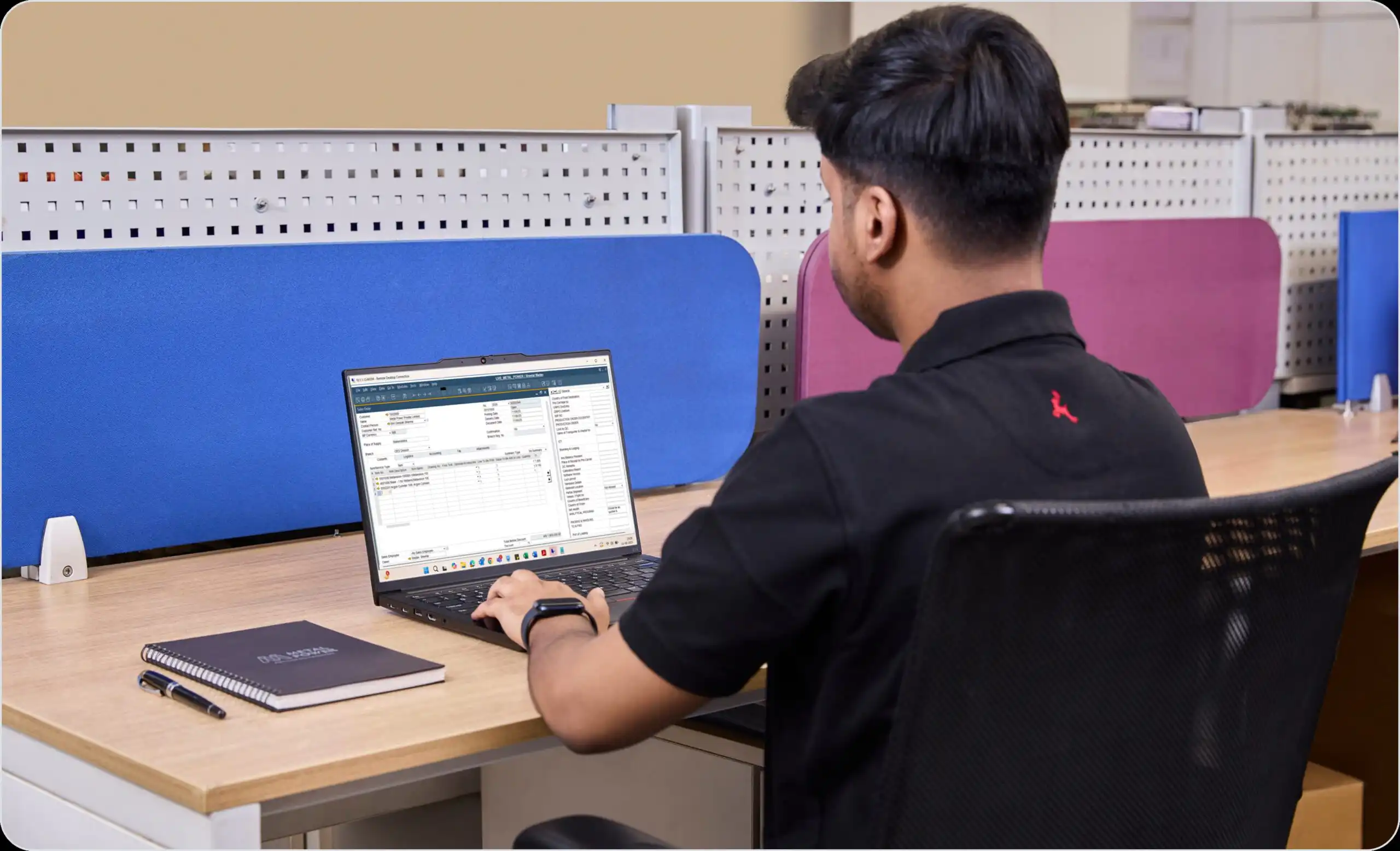 Person working on laptop at desk